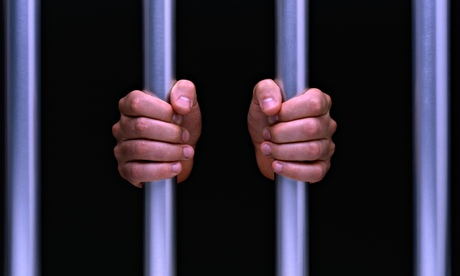 hands on prison bars