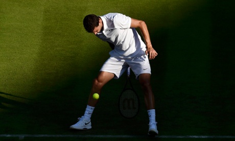 Grigor Dimitrov plays a shot through his legs against Federico Delbonis.