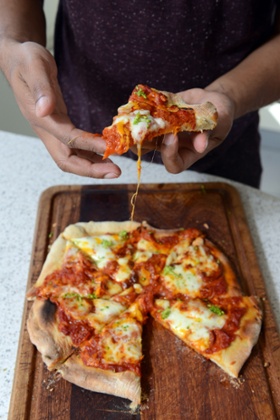 Pizza cooked in a pizza oven.