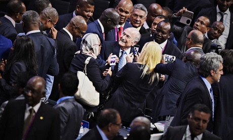 FIFA President Sepp Blatter (C) is greet