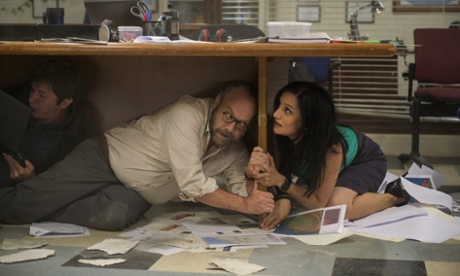 Paul Giamatti and Archie Panjabi in San Andreas.