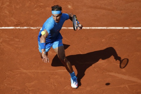 Nadal hits a return.