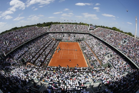 Novak Djokovic hits a return to Nadal in front of a packed house.