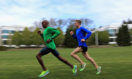 Mo Farah of Great Britain and Galen Rupp of the USA train on the grass at the Nike campus