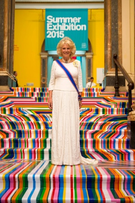 The Duchess of Cornwall ascends to the Royal Academy Annual Dinner via the central staircase transformed by artist Jim Lambie.
