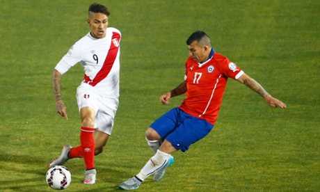 Peru's Paolo Guerrero, left, tries to evade Chile's Gary Medel with some nifty footwork during the Copa América semi-final in Santiago.