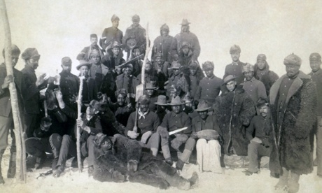 Buffalo Soldiers of the 25th Infantry, some wearing buffalo robes, photographed at Fort Keogh, Montana during the US civil war.