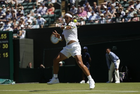 Nadal smashes a forehand return.