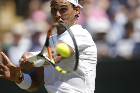 Rafael Nadal returns.