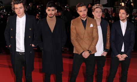 That directional polo neck … Zayn Malik (second left) with One Direction in December 2013.