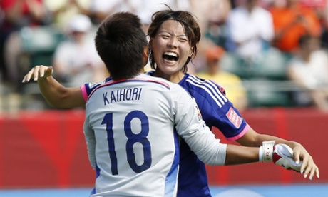 Japan's Saki Kumagai and Ayumi Kaihori celebrate their victory over Australia