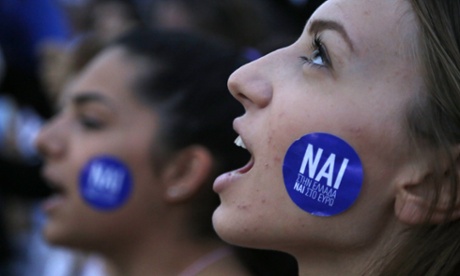 A supporter of the yes vote in the upcoming referendum at a rally outside the Greek parliament on Tuesday. The sticker reads: ‘Yes to Greece, yes to euro.’