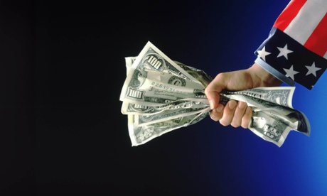 arm holding crumpled hundred dollar bills