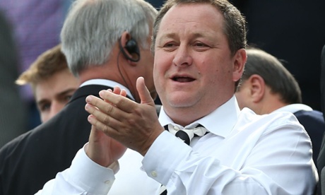 Mike Ashley applauds  at a match between Newcastle United and West Ham United at St James's Park