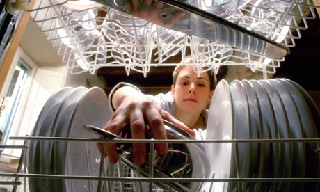 Woman loading dishwasher