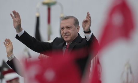 Turkey's President Recep Tayyip Erdogan waves to crowds during a rally.
