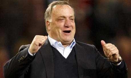 Dick Advocaat celebrates after the draw at Arsenal which secured Sunderland's Premier League survival.