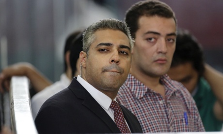 Canadian al-Jazeera journalist Mohammed Fahmy, left, and his Egyptian colleague Baher Mohammed, in a court in Cairo, Egypt.