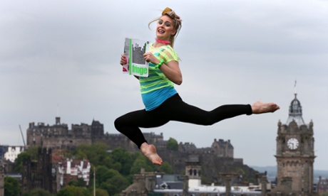 Acrobat Zoe Paterson with a copy of the Edinburgh fringe 2015 programme.