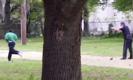 Walter Lamer Scott running from city patrolman Michael Thomas Slager in North Carolina; Slager has been fired and charged with murder after firing eight shots at Scott.
