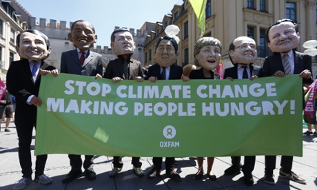 Demonstrators wearing masks representing world leaders protest against the G7 summit in Munich on Thursday.