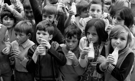 School children drink their free milk at Woodhill Junior Mixed School, Woolwich.