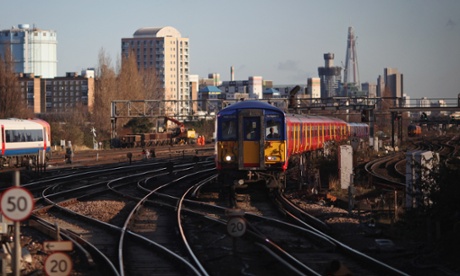 A train arrives at Clapham Junction station.