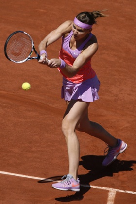 Lucie Safarova smacks a return back to Williams.