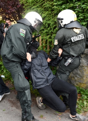 Protesters and police officers clash in Garmisch-Partenkirchen.