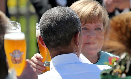 Obama and Merkel enjoy a beer at a breakfast meeting.
