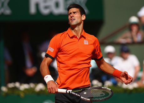 Novak Djokovic reacts to Wawrinka’s play.