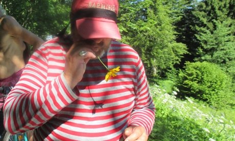 Man with arnica flower