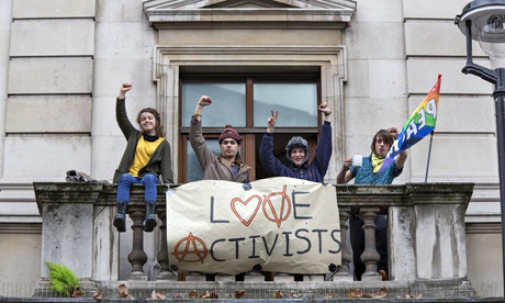 squatters with a poster saying love activists
