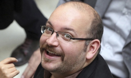 Jason Rezaian, a correspondent for the Washington Post, smiles as he attends a presidential campaign of Hassan Rouhani in Tehran in 2013.