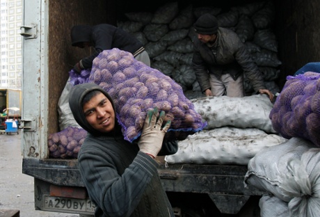 Tajik migrant workers at a vegetable market on the outskirts of Moscow.