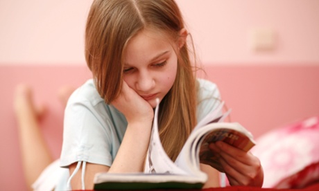 young girl reading book