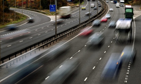 Cars speeding past on a motorway