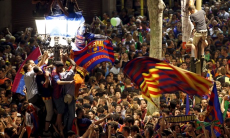 Barcelona soccer fans celebrate their victory after winning the soccer Champions League final against Juventus at Canaletes fountain in Las Ramblas of Barcelona, Spain, June 6, 2015