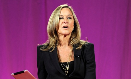 Angela Ahrendts, head of retail for Apple, speaks as she holds an Apple Inc. iPad at the 2011 World Business Forum in New York, U.S., on Wednesday, Oct. 5, 2011.