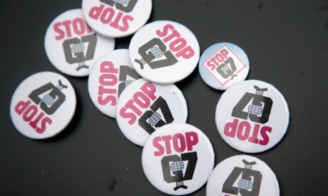 Anti-G7-buttons are displayed during the last anti-G7 protesters' meeting marking the end of the anti-G7-protest at Garmisch-Partenkirchen main station, near the venue of the summit of G7 nation leaders, on the second day of the summit on June 8, 2015 at Garmisch, Partenkirchen, Germany.