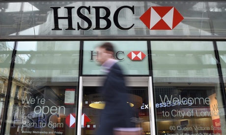 A pedestrian walks past a HSBC bank branch in London.