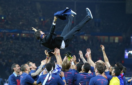 A sock-less FC Barcelona manager Luis Enrique is thrown in the air by his players after winning the UEFA Champions League UEFA Champions League on Saturday