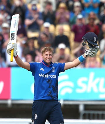 Joe Root celebrates reaching his century.