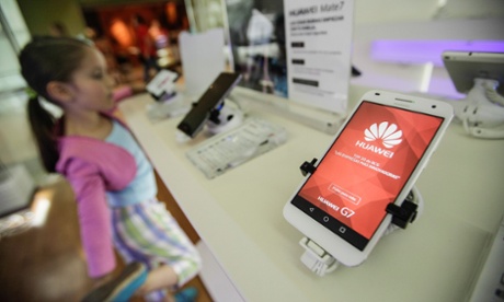 A girl looks at high tech products of China's technology products at a mobile phone store in Bogota City, capital of Colombia, on May 21, 2015.