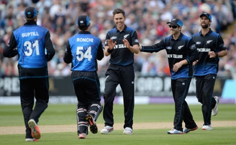 Trent Boult celebrates with teammates after dismissing Joe Root.
