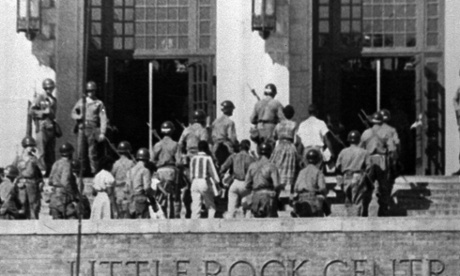 Troops escort nine black students into Central High School in Little Rock, Arkansas on Sept. 25, 1957. A battle over school segregation are the subject of a new book by the journalist Kristen Green. (AP Photo/File)