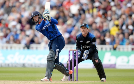 Jos Buttler thwacks a six as New Zealand's Luke Ronchi looks on.