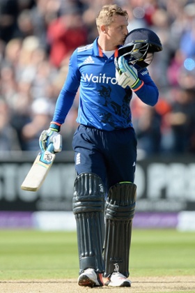 Jos Buttler celebrates reaching his century.