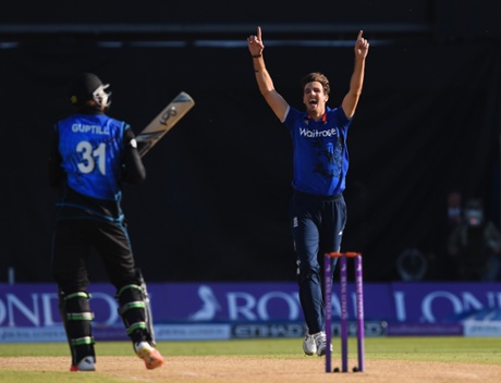 Steven Finn celebrates taking the wicket of Martin Guptil.