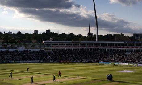 England players congratulate spin bowler Adil Rashid for taking the wicket of New Zealand batsman Kane Williamson.